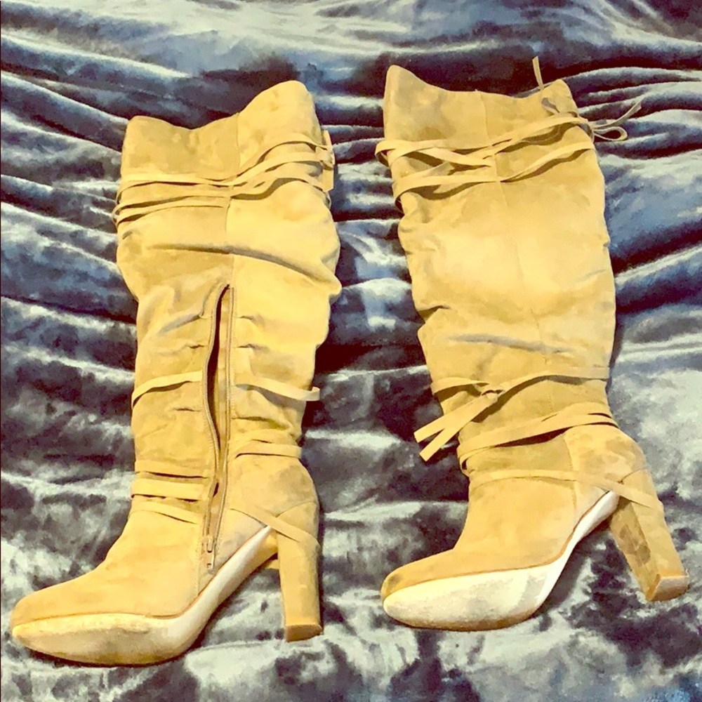 Knee high suede boots.